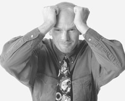 man with hands on his head